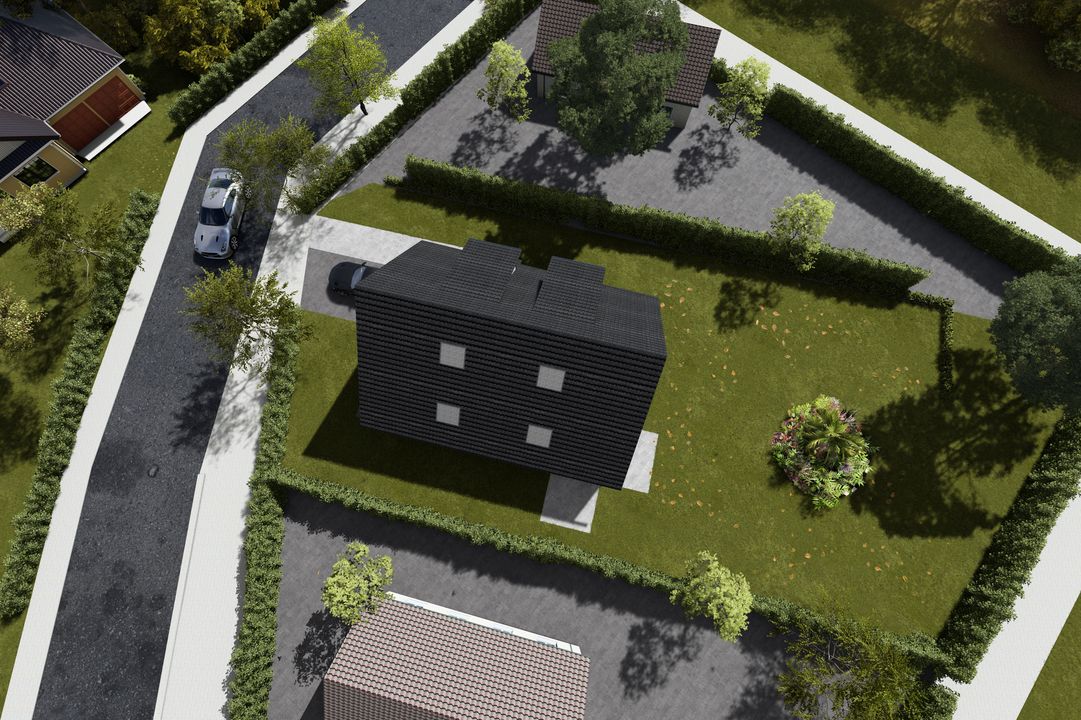 Aufnahme aus der Luft auf ein Einfamilienhaus mit Garten